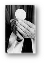 Priest holding the Sacred Body of Jesus in the Host you receive during Holy Communion